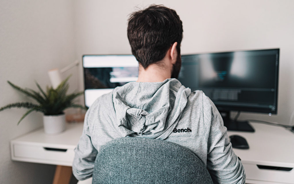 Claudio Schwarz image, Unsplash - man working from home during Covid-19 lockdown